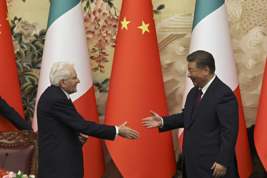 Chinese President Xi Jinping, right, and Italian President Sergio Mattarella shake hands at a signing ceremony at the Great Hall of the People in Beijing, Friday, Nov. 8, 2024. (Florence Lo/Pool Photo via AP)