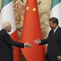 Chinese President Xi Jinping, right, and Italian President Sergio Mattarella shake hands at a signing ceremony at the Great Hall of the People in Beijing, Friday, Nov. 8, 2024. (Florence Lo/Pool Photo via AP)