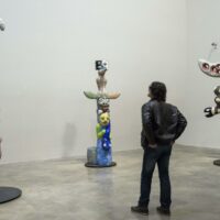 A man looks at sculptures displayed during a preview of a retrospective exhibition on French-US artist Niki de Saint Phalle (1930-2002) at the Guggenheim Museum in Bilbao city, Basque Country, northern Spain, 26 February 2015. The retrospective, the first major exhibition devoted to De Saint Phalle in twenty years, runs from 27 February to 11 June 2015. EFE/Miguel Tona