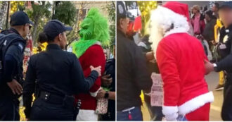 Copertina di Babbo Natale e Grinch si azzuffano per strada e vengono arrestati: la scena ripresa dai passanti diventa virale sui social – VIDEO