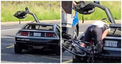 Copertina di Ciclista non si accorge della DeLorean e si schianta contro l’auto: la scena ripresa dai curiosi che fotografano la vettura