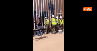 Copertina di Trump ordina di verniciare di nero il muro tra Usa e Messico per renderlo incandescente. E la “sua” segretaria fa il video durante i lavori