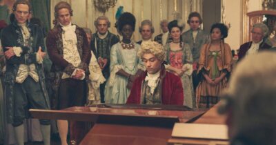 Copertina di Mozart: tra genio e gelosia, Nicolas Cage  è in “nero” e la sveglia per  Castellucci