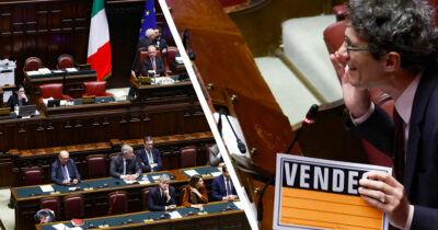 Copertina di Fiducia sulla manovra - la diretta tv. Restano i nodi che hanno spaccato la maggioranza. Magi in aula con il cartello "vendesi"