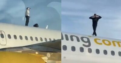 Copertina di Sale sulla fusoliera di un aereo passeggeri e mima gesti verso il personale: fermato – VIDEO