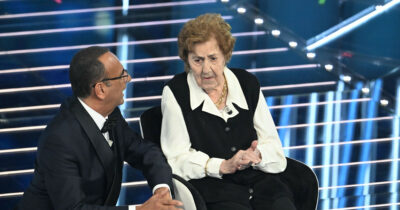 Copertina di “Mi alzo all’una tutti i giorni, mangio il brodo e due gelati al giorno gusto fiordilatte”: i “segreti” di longevità della signora Gianna, la 105enne che ha conquistato Sanremo