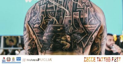 Copertina di Il tatuaggio con l’assalto al portavalori vince un premio al Lecce Tattoo Fest, il prefetto: “Linguaggio mafioso da disprezzare”
