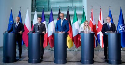 Copertina di Gli E5 in panne in call con gli Usa. Merz da 5 a  3,5%