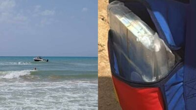 Copertina di Pacchi pieni di banconote gettati in mare da due persone a bordo di un motoscafo in panne: i bagnanti corrono a recuperare il denaro, intervengono le forze dell’ordine