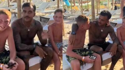 Copertina di Geolier rifiuta la foto con i bambini in spiaggia e cambia il copione: “Venite, parliamo un po’”. Perché il gesto del rapper ha colpito il web – IL VIDEO