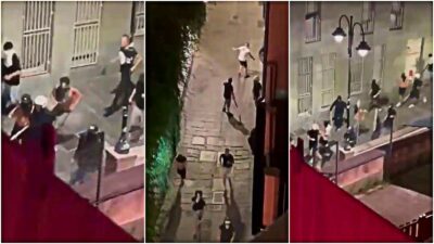 Copertina di Spranghe, petardi e fumogeni: ultras incappucciati seminano il panico in centro, paura a Genova. Era una “spedizione punitiva” – Video