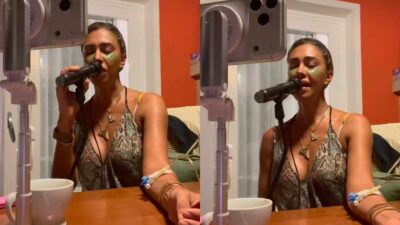 Copertina di Belen Rodriguez canta sui social con la flebo al braccio: “Puro esibizionismo”. Lei sbotta: “Esibirmi è il mio lavoro. Cosa voglio dimostrare? Un emerito c***o, sto solo cantando!”