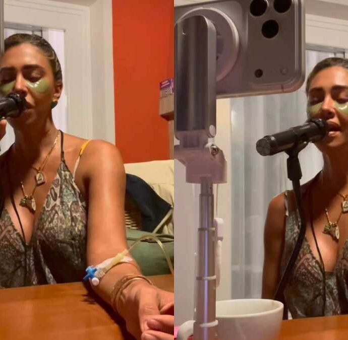 Belen Rodriguez canta sui social con la flebo al braccio: “Puro esibizionismo”. Lei sbotta: “Esibirmi è il mio lavoro. Cosa voglio dimostrare? Un emerito c***o, sto solo cantando!”