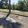 Copertina di Trovato morto in un parcheggio con segni di colpi di pistola: indagini per omicidio nel Varesotto