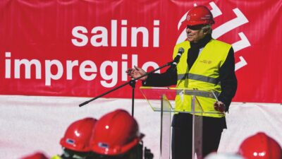 Copertina di Extra-costi: Webuild cala in Borsa e attacca il Fatto