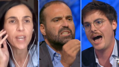 Copertina di Marattin litiga con Mannocchi, poi insulta Romano: “Propagandista ignorante”. Ma sbaglia la risoluzione Onu: la gaffe su La7